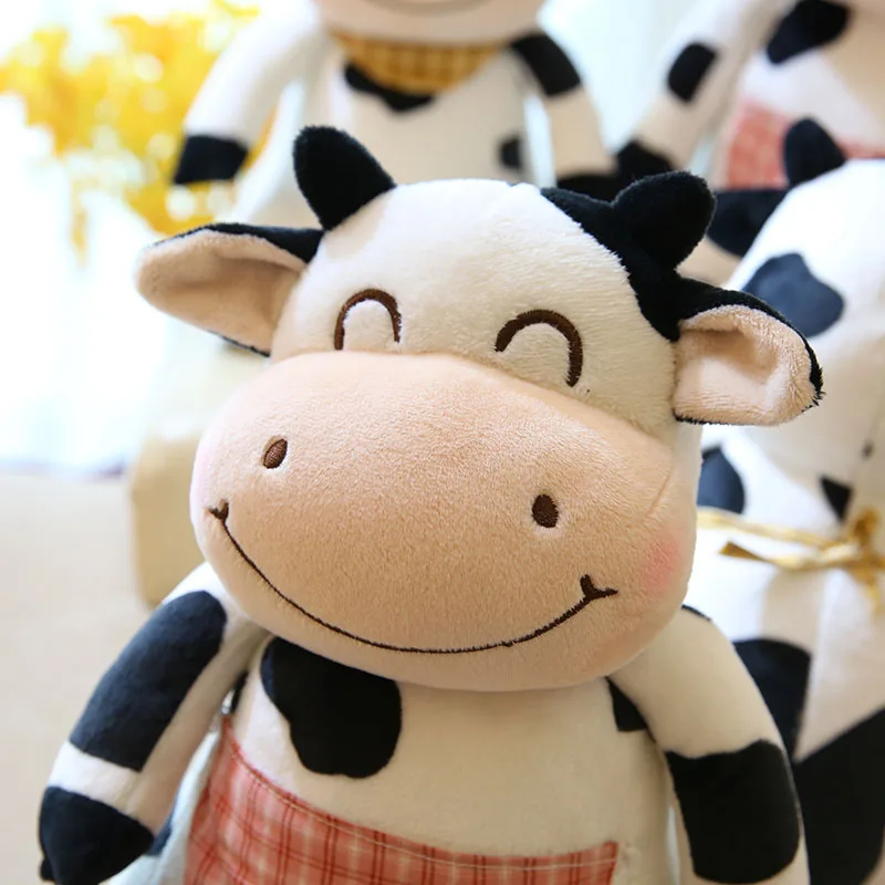 close up of the face of cute cow stuffed animal toy