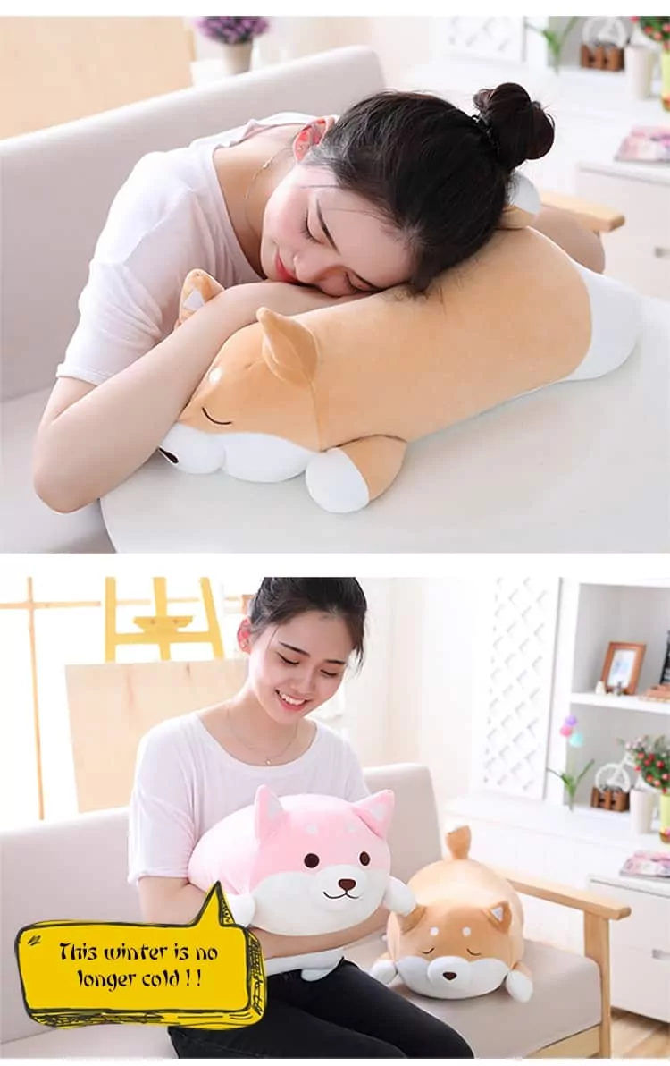 woman holding and sleeping on a cute fat shiba inu plush toy