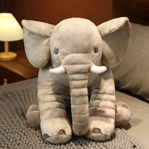 Baby Elephant Stuffed Animal Front view of a grey baby elephant stuffed animal sitting.