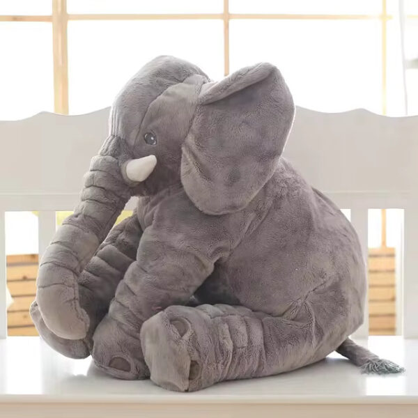 Baby Elephant Stuffed Animal A grey baby elephant stuffed animal sitting.