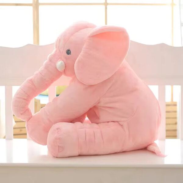 Baby Elephant Stuffed Animal A pink baby elephant stuffed animal sitting.