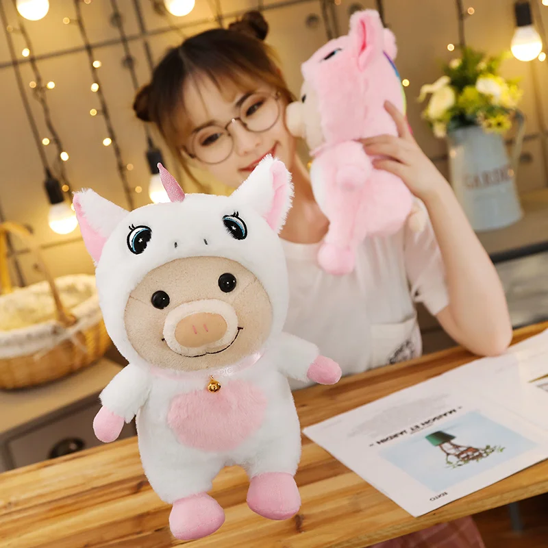 woman playing with pink and white unicorn cute pig plush