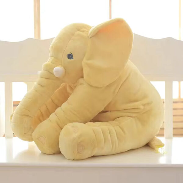 Baby Elephant Stuffed Animal A yellow baby elephant stuffed animal sitting.