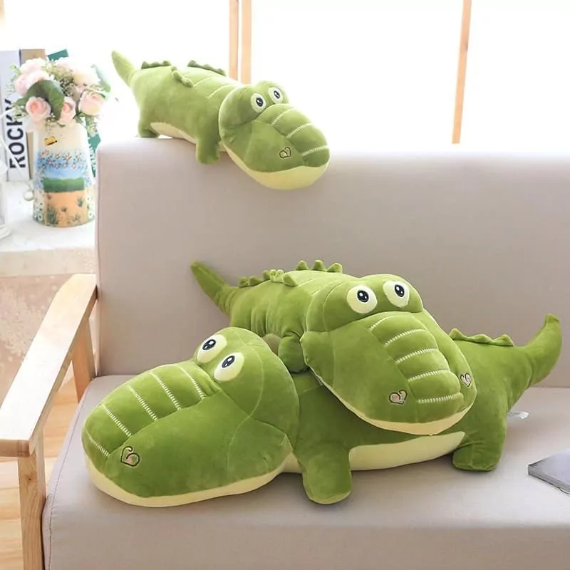 three kawaii alligator stuffed toy in a sofa