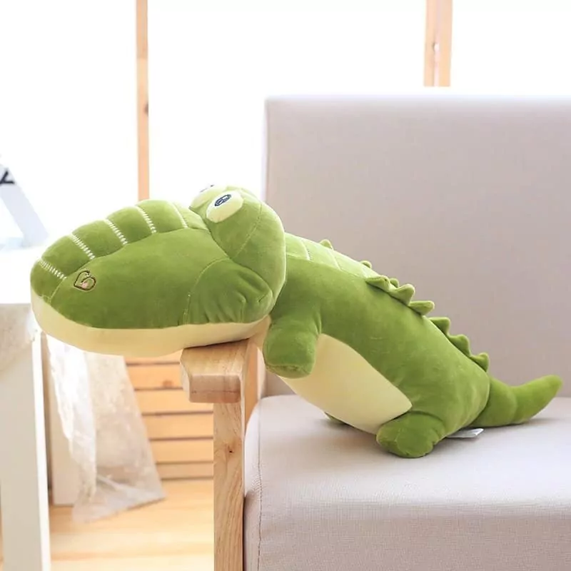 kawaii alligator plush pillow in a sofa