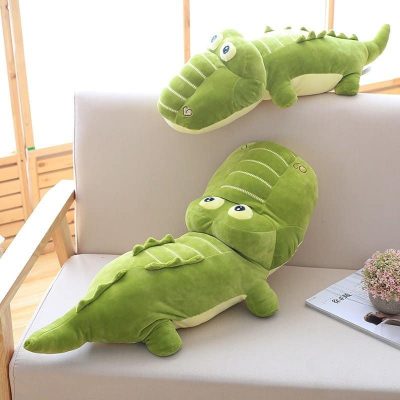 two kawaii alligator stuffed pillow in a sofa