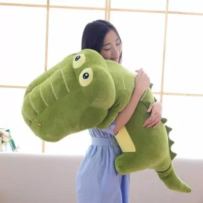 two kawaii alligator stuffed pillow in a sofa