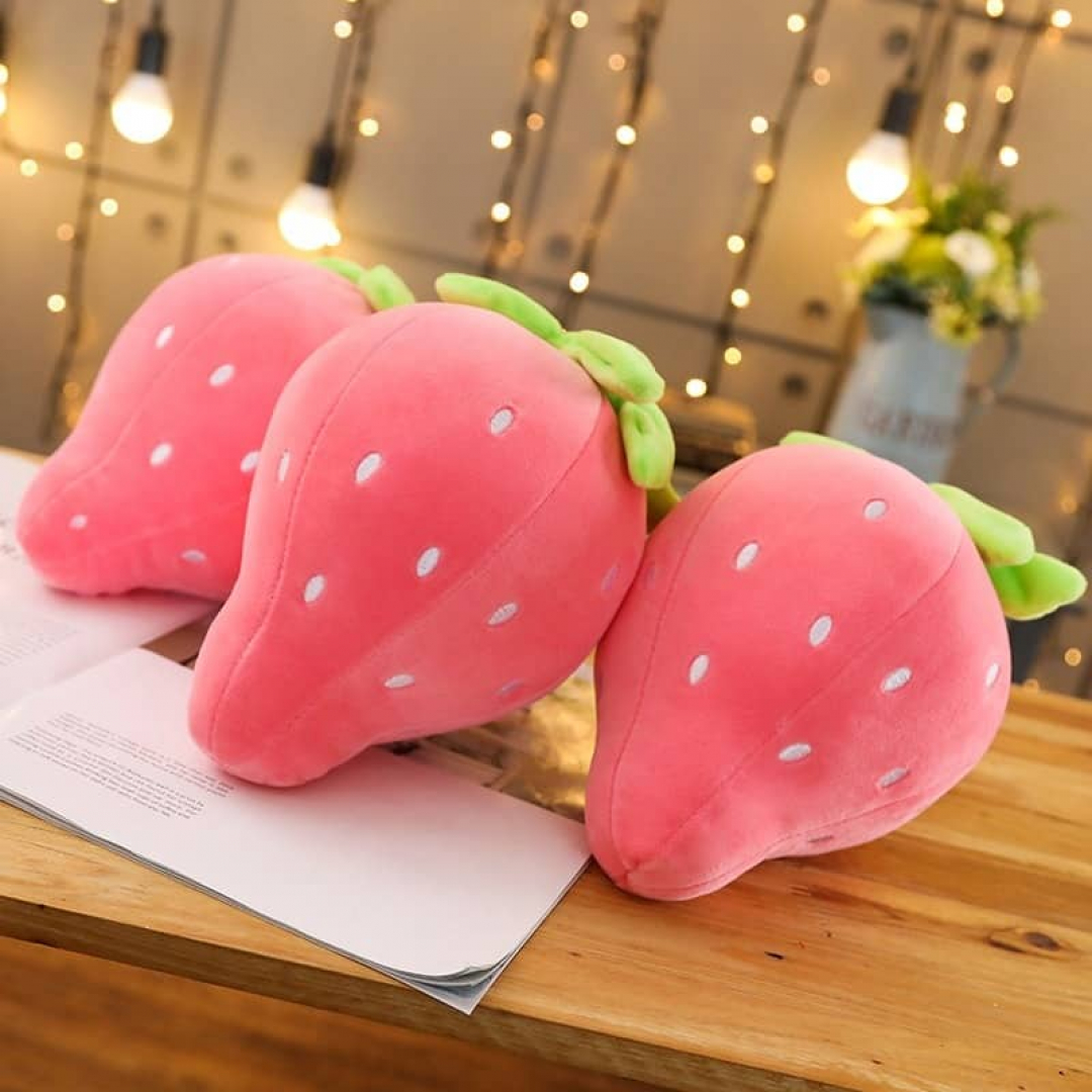 3 three cute pink strawberry soft pillow in a table