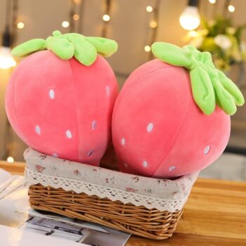 two cute pink strawberry stuffed toy in a basket