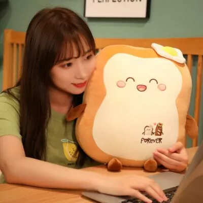 Woman smiling while holding a Kawaii Japanese Loaf Bread Plush