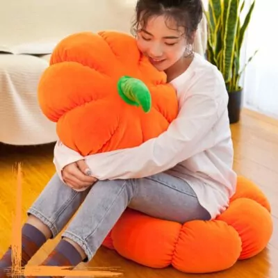 Multiple Plush Pumpkin in a bed room