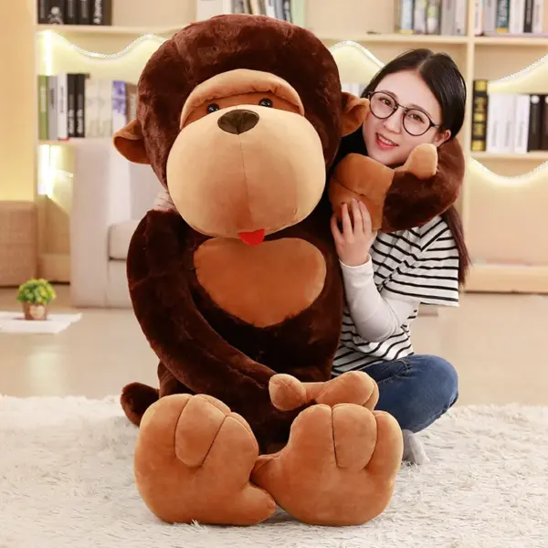 A smiling woman posing with an oversized monkey stuffed animal, showcasing its large size and cuddly texture.
