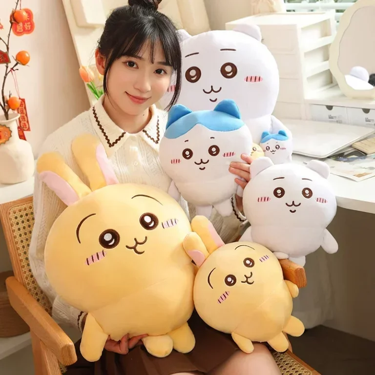 Woman holding different sizes of chiikawa hachiware and usagi plushies