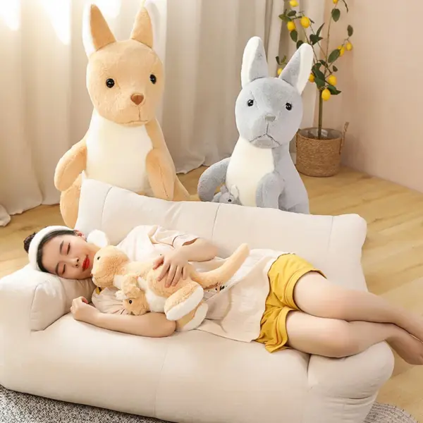 Kangaroo Stuffed Animal Woman sleeping in a sofa with brown and grey kangaroo plush behind her