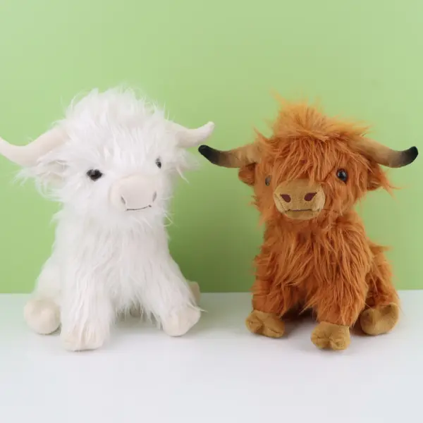 brown and white highland cow plush