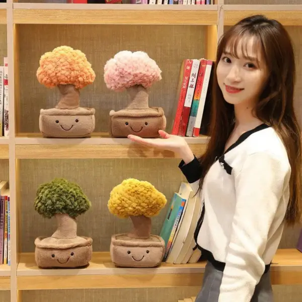 Woman showing the different colors of money tree plushies